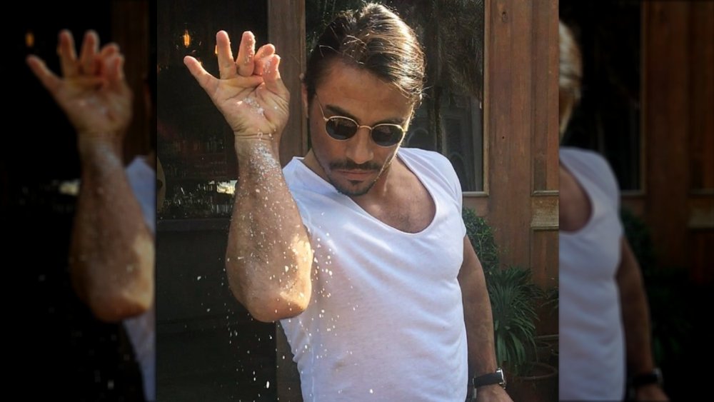 Salt Bae doing his signature salting move