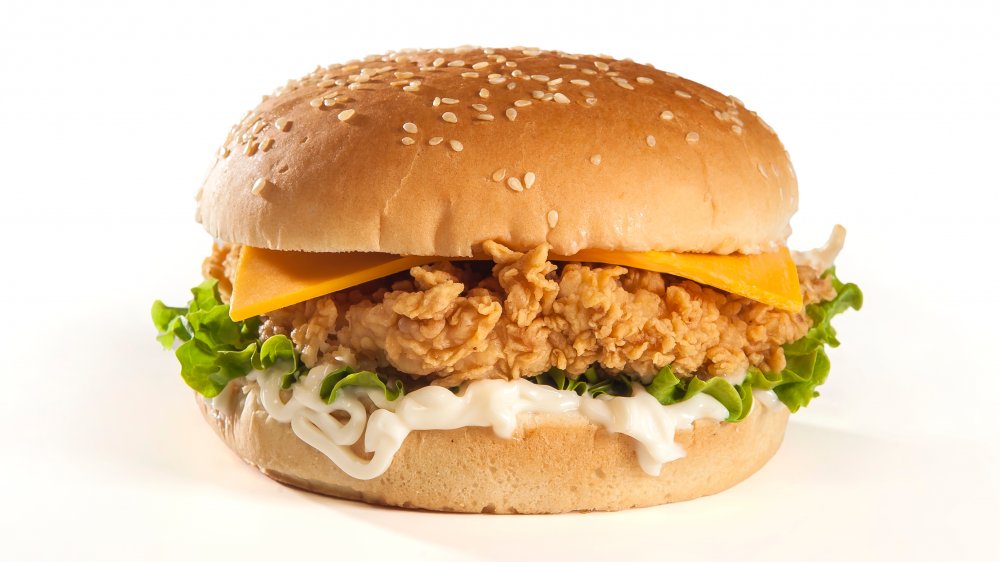 Fried chicken sandwich with mayo, lettuce, and cheese