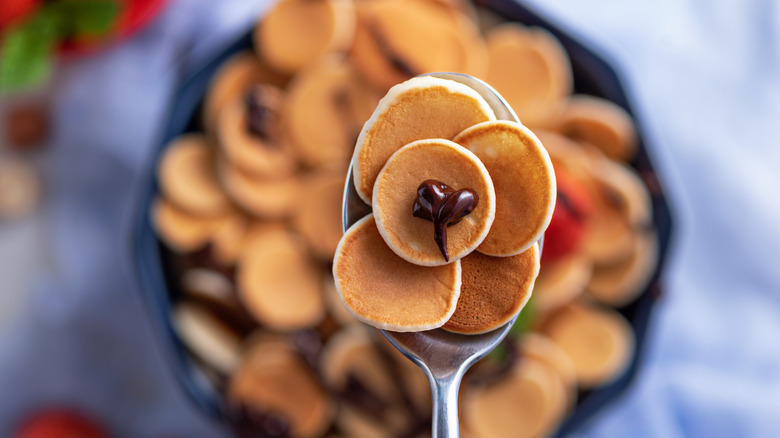 Mini pancakes in a cereal spoon