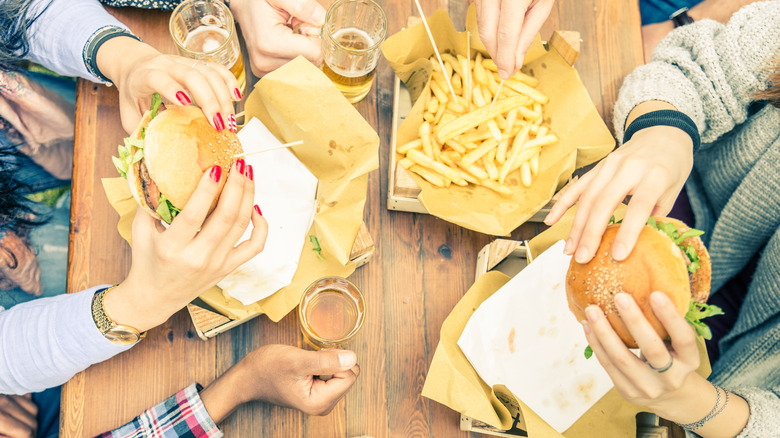 friends sharing burgers