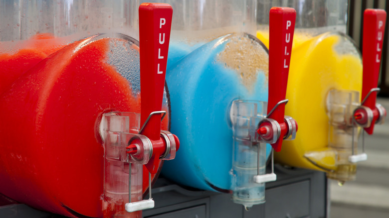 three flavors of Slurpees in machines