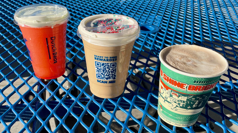 Three Dutch Bros' holiday drinks on table