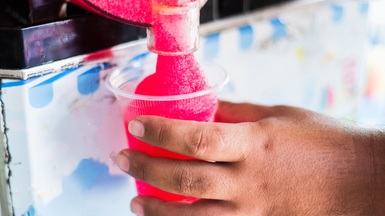 Person pouring a slushie 