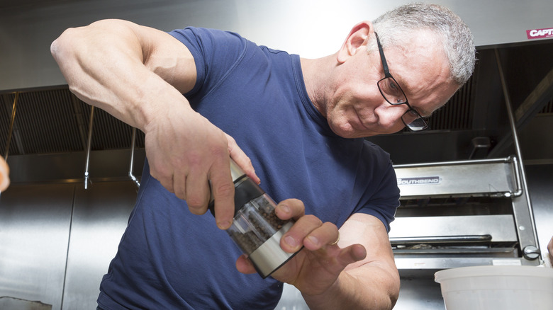 Chef Robert Irvine grinding pepper