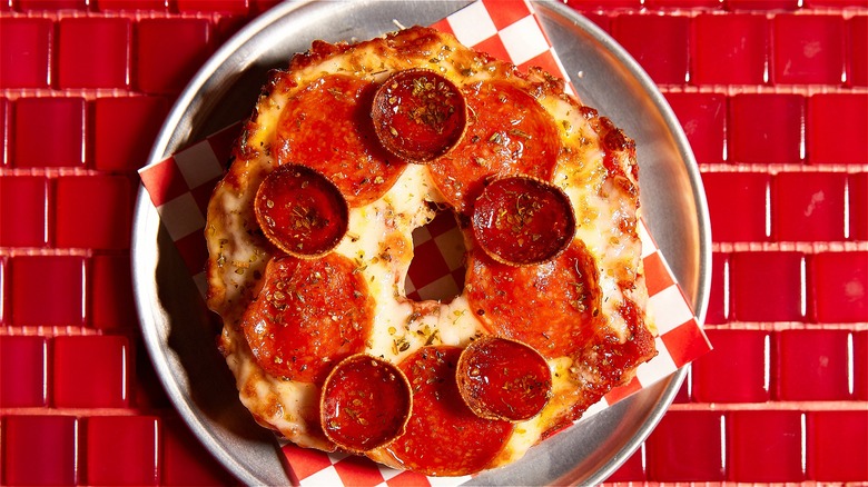 Pizza bagel on white plate