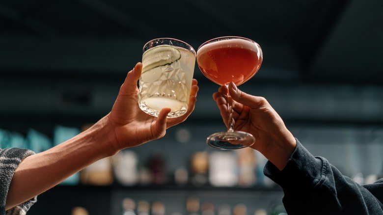 cheers with two cocktails