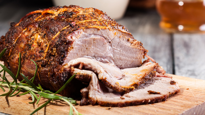 roasted sliced pork on cutting board