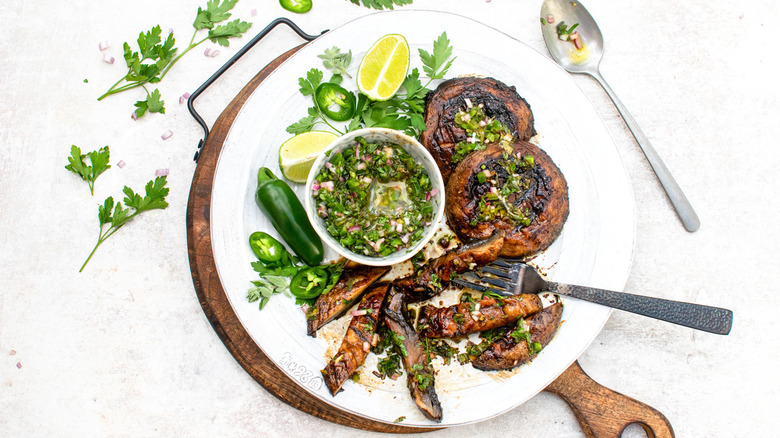 grilled portobello mushrooms with jalapeño chimichurri and fork