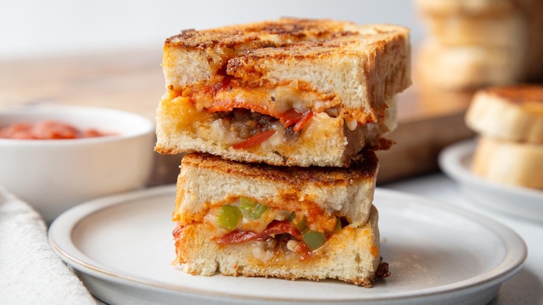 pizza grilled cheese on white plate