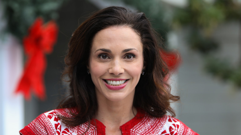 Aida Mollenkamp smiling while wearing red