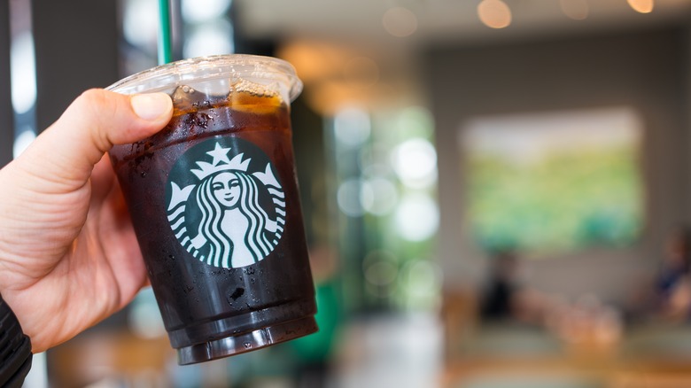 hand holding iced Starbucks drink