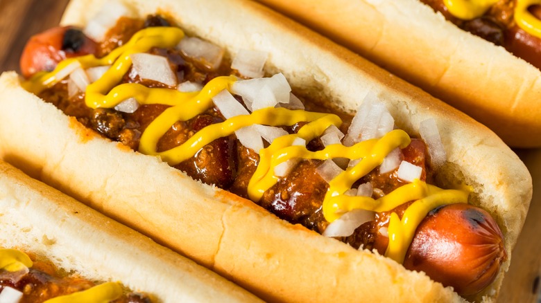 Chili, mustard, and onion hot dog