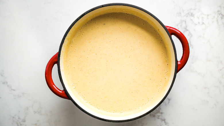 cream and broth in pot