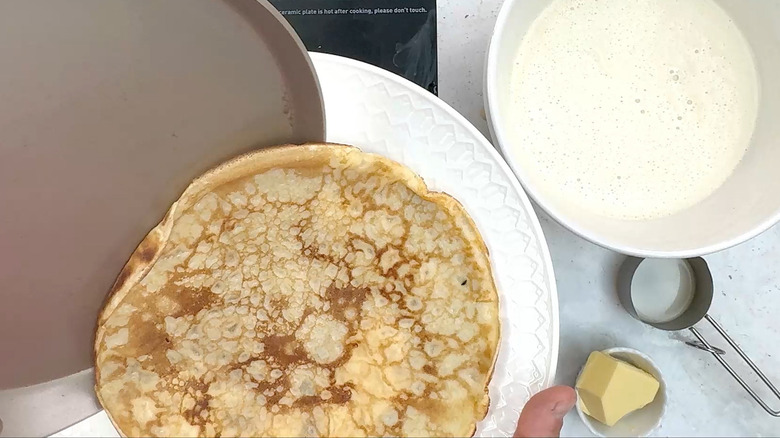 transferring crepe to plate