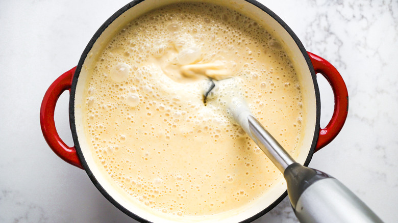 blending potato soup in pot