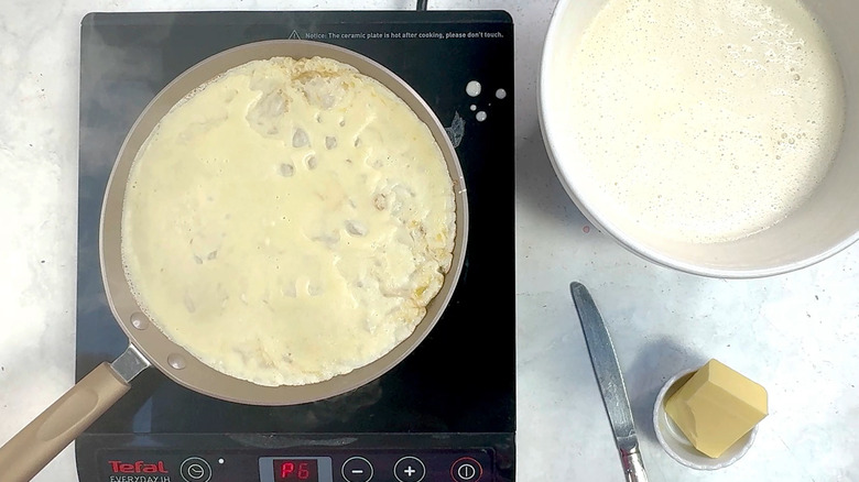 crepe cooking in pan