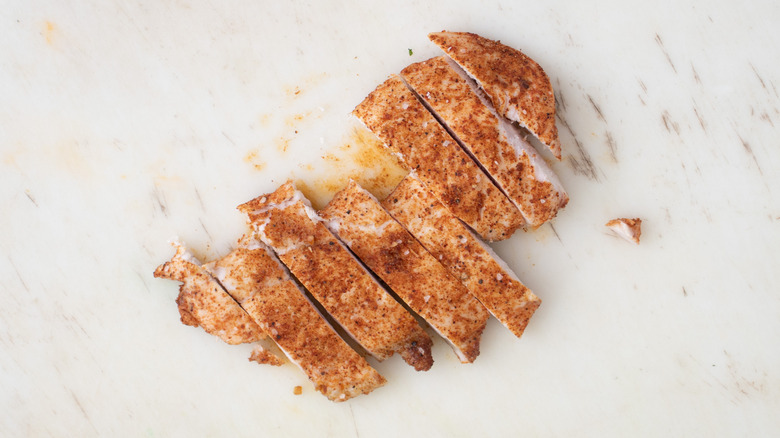 sliced chicken breast on counter