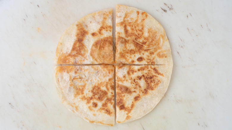 toasted quesadilla cut in four