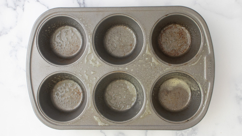 greased muffin pan