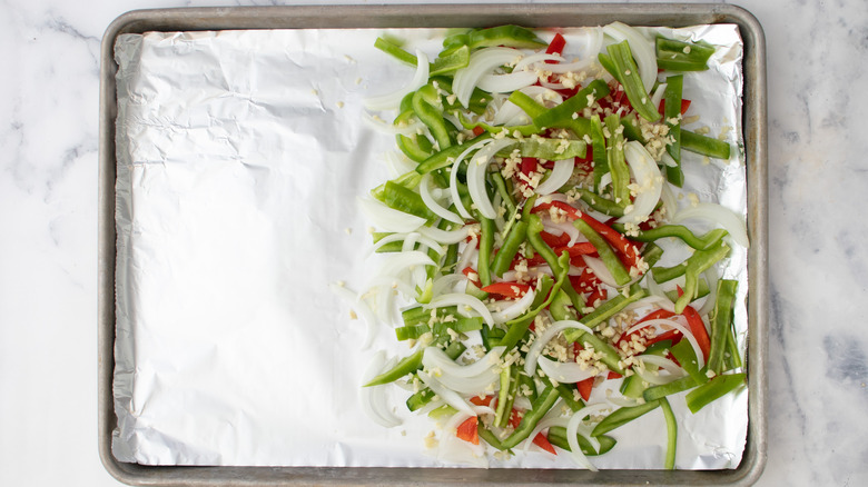 raw vegetables on baking sheet