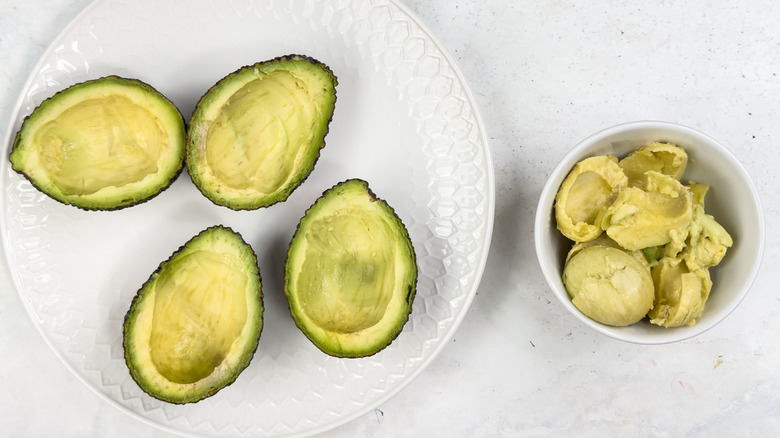 half-emptied avocados