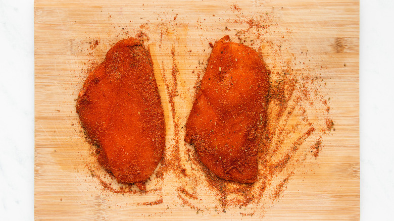 spice-covered chicken breasts