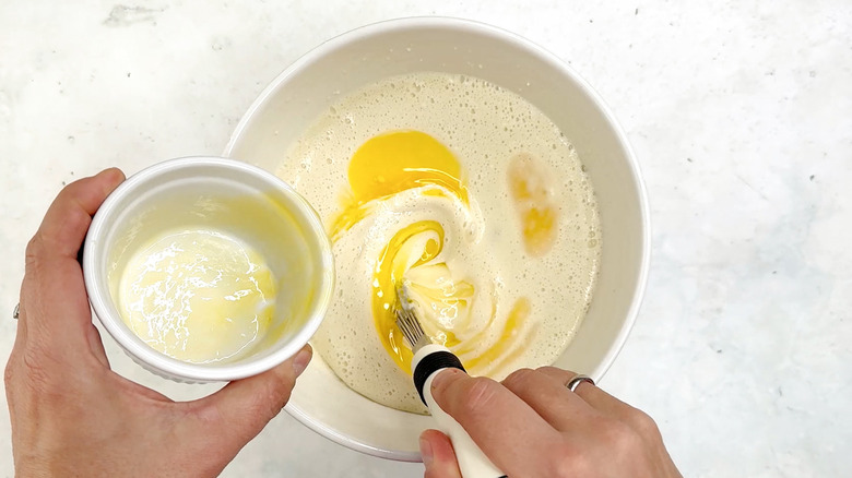 whisking butter in crepe batter