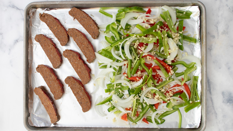 meatloaf and vegetables on sheet