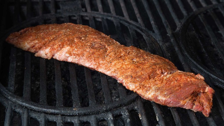 raw skirt steak on a grill