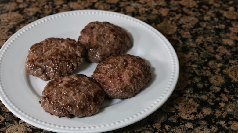 cooked burgers on plate