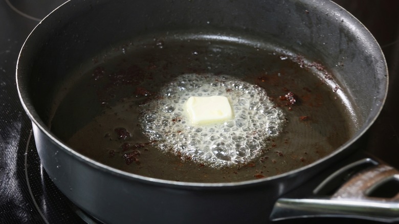 butter melting in skillet