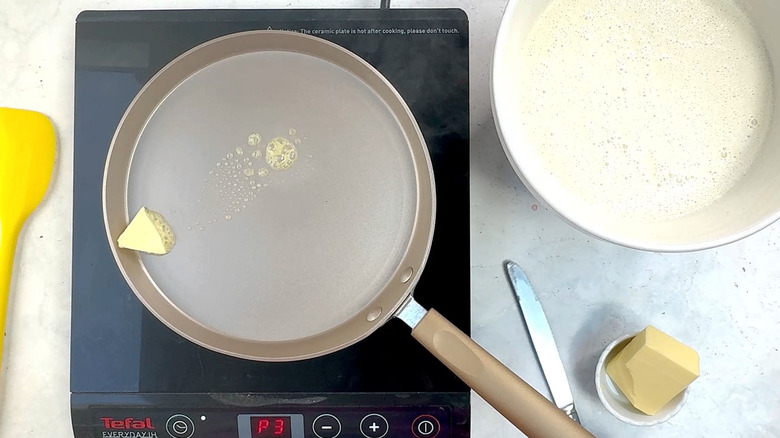 butter melting in crepe pan