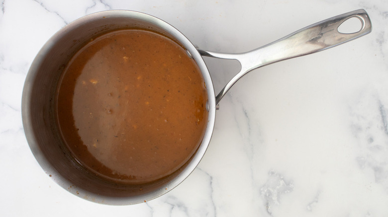 reddish-brown sauce in pan