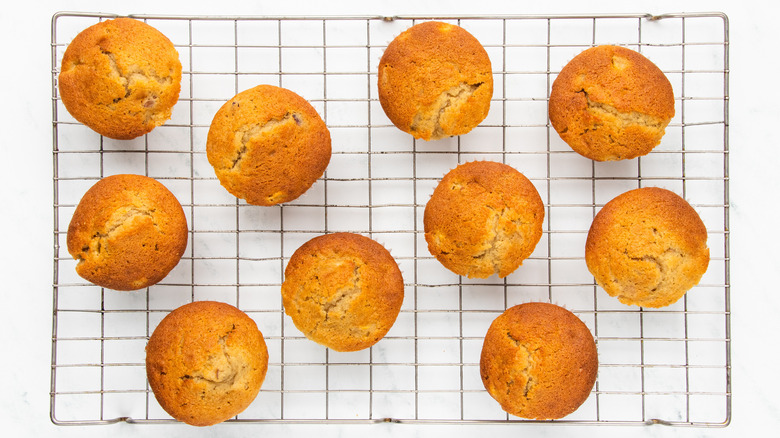 peach muffins on wire rack