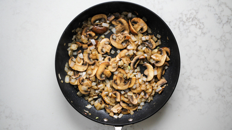 onions and mushrooms in pan