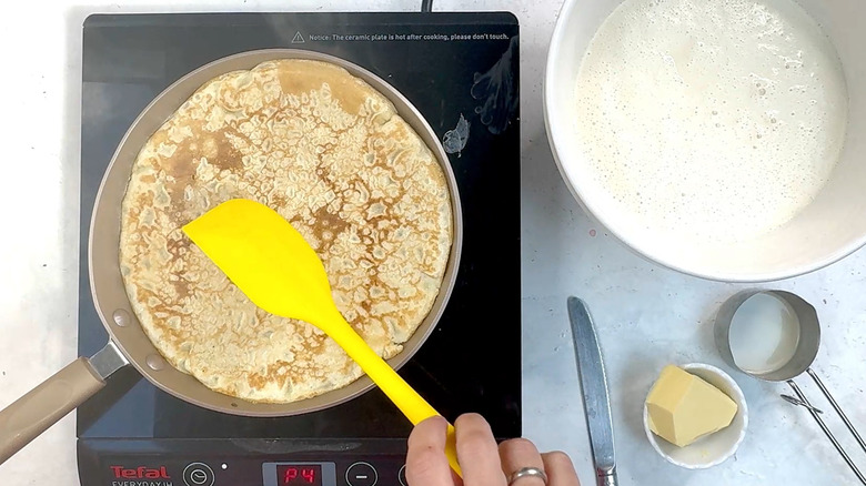 flipping crepe with spatula