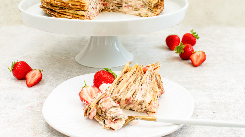 slice of strawberries and cream crepe cake