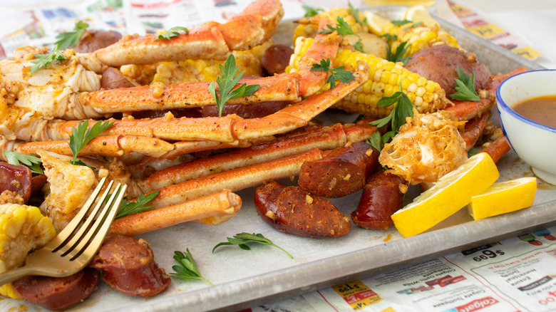 crab legs, potatoes, sausage, corn